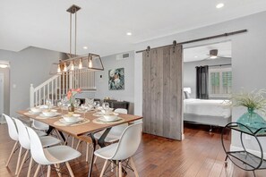The dining area leads into the king bedroom downstairs