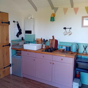 Kitchen includes small fridge,toaster,microwave & most things you could need