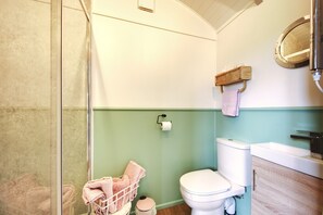 large shower, loo and little sink all in the hut