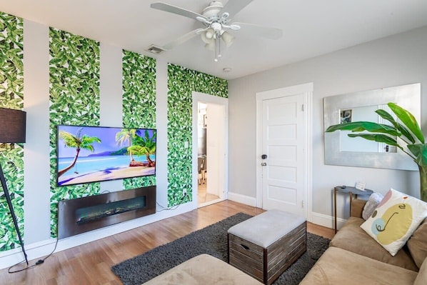 Spacious lounge, modern entertainment, cozy furnishings.