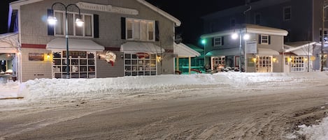 Front of building at night in snow