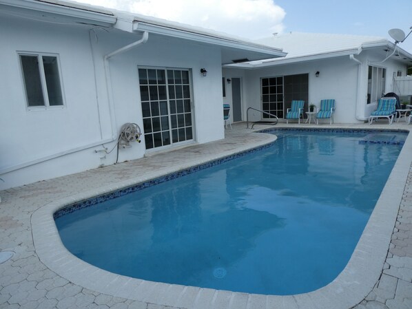 New diamond Brite heated pool and patio area.2 patio tables,12 chairs.8 chaises