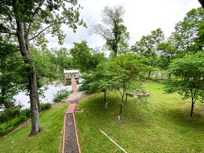 Backyard from Deck overlooking lake as of 5/31/2022.