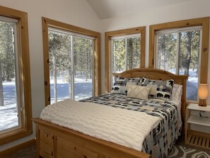 Main floor "sunroom" with queen bed