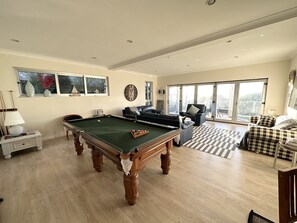 Living room with full size billiard table
