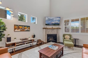 The inviting indoor fireplace creates an intimate gathering setting