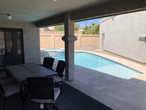 Private back patio with 4 burner infrared barbecue entertains 6+ guests 