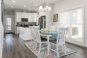 Gather around our large table to enjoy your favorite meal.