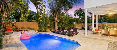 Tranquil garden like pool area with sparkling LED lights for night swimming.  