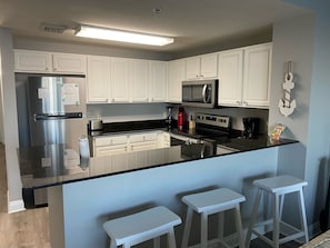 Kitchen with 3 barstools