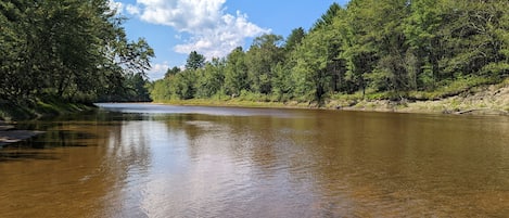 Enjoy your own private beach on the Saco River (100 yards behind cabin)!