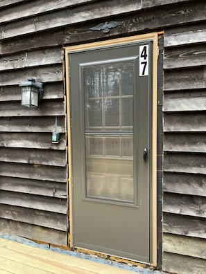 Front door with house number. 
