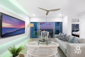 Living room overlooking the ocean and the city
