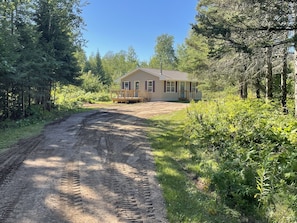 Tree-lined 
Long driveway with plenty of parking 

