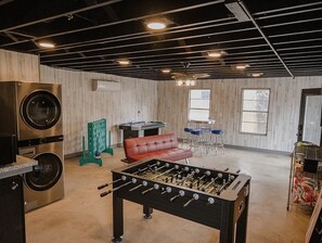 Game room w/ foosball, air-hockey, darts, karaoke, mini fridge microwave, & TV. 