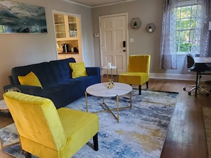 Living room with view to kitchen