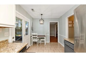 Small dining area in kitchen for grabbing a quick snack or working remotely.