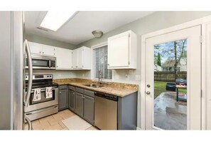 Perfect sized full stocked kitchen for cooking and preparing snacks. 