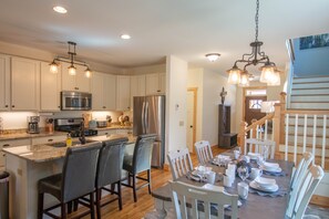 Bar seating and the dinner table is set...