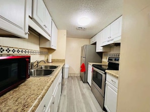 Prepare delicious meals- Fully Equipped Kitchen