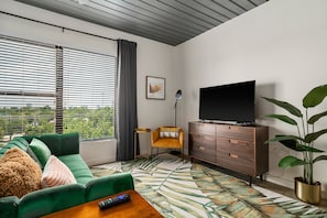 Experience true comfort in this cozy living area with a smart TV.