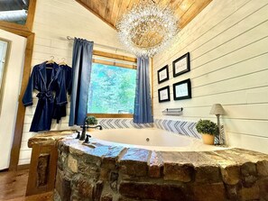 Bougie crystal spray hangs in the corner for a romantic soak in the tub.