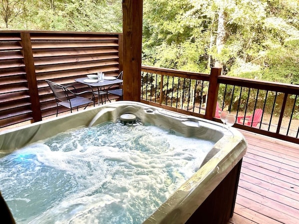 Hot tub conveniently positioned for views of the trees.