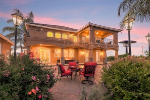 Sunset view of the backyard and patio.