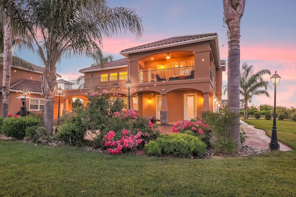 Sunset view of the backyard and patio.