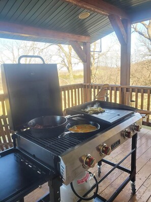 Outdoor cooking on grill and griddle combination.  (Food not included)