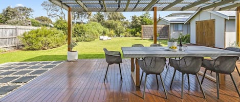 Expansive alfresco and huge enclosed lawn makes the perfect backyard for kids