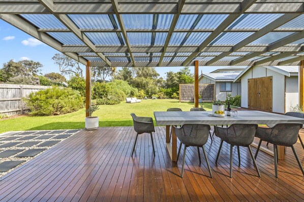 Expansive alfresco and huge enclosed lawn makes the perfect backyard for kids