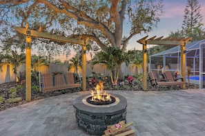 This incredible outdoor patio is complete with a Breeo smokeless fire pit and incredible outdoor swings to go with it!