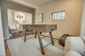 This foosball table is right off of the living room! You can settle into the comfy lounge chairs to watch the action.