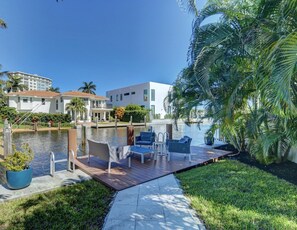 Tranquil waterside seating in the rear yard