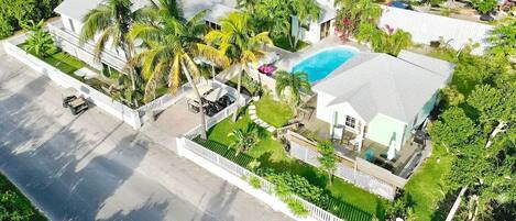 Main house on the left, guest house to right of pool