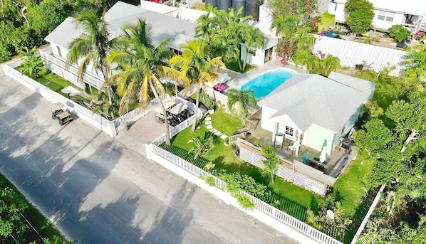 Main house on the left, guest house to right of pool