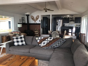 Living room with huge, cozy sectional and 42” TV, with Roku.