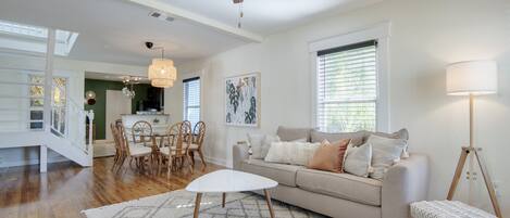 The airy living room is the perfect spot to watch a movie on the Smart TV.