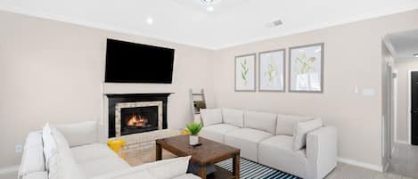 Relax in the warm and inviting living space by the fireplace