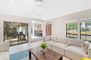 Open up the glass doors to create a seamless indoor/outdoor space