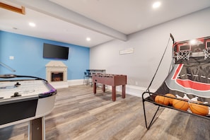 Game room with Foosball, Basketball,  Seating area , Tv, Electric fireplace