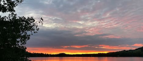 Sunrise from dock. Bring your coffee to the lake. Listen to the fish jumping.