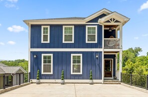 The front of the home boasts a 3 car driveway and an inviting entrance way.