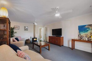 Lounge with smart TV and pot belly stove