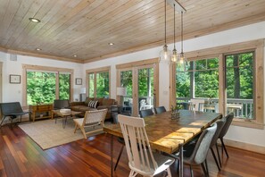 Share meals at the dining table situated conveniently next to the kitchen, fostering easy conversation and connection.