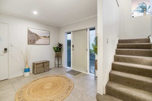 Entrance and stairs to upper level