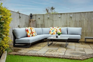 Comfy outdoor sofa to enjoy the sunshine or an evening drink.