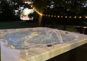 Enhance your evening by witnessing a breathtaking sunset over Lake Michigan while relaxing in the hot tub! It's an unforgettable experience that you will not want to miss!