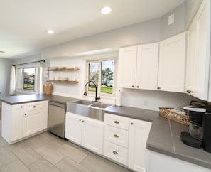 Enjoy a fully stocked kitchen! Everything you need to cook your meals is here. The kitchen has an electric stove, microwave, dishwasher, refrigerator, freezer, and a large pantry cupboard to store all of your groceries.